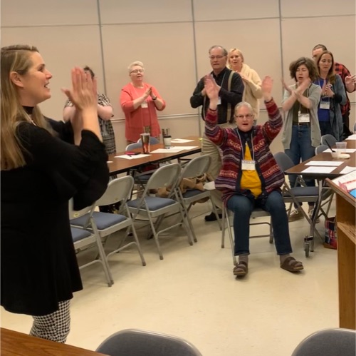 Angela Naeve led the group in singing and showed them accompanying hand motions!